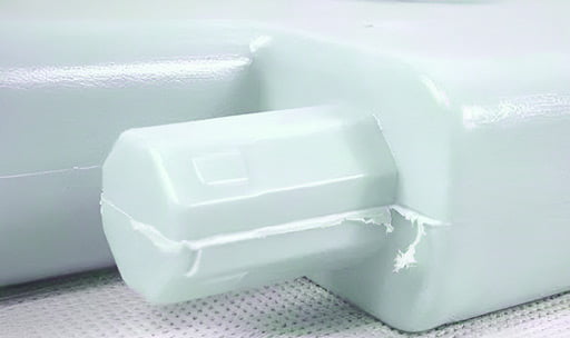 Injection molding defect example: Flash in a plastic part.